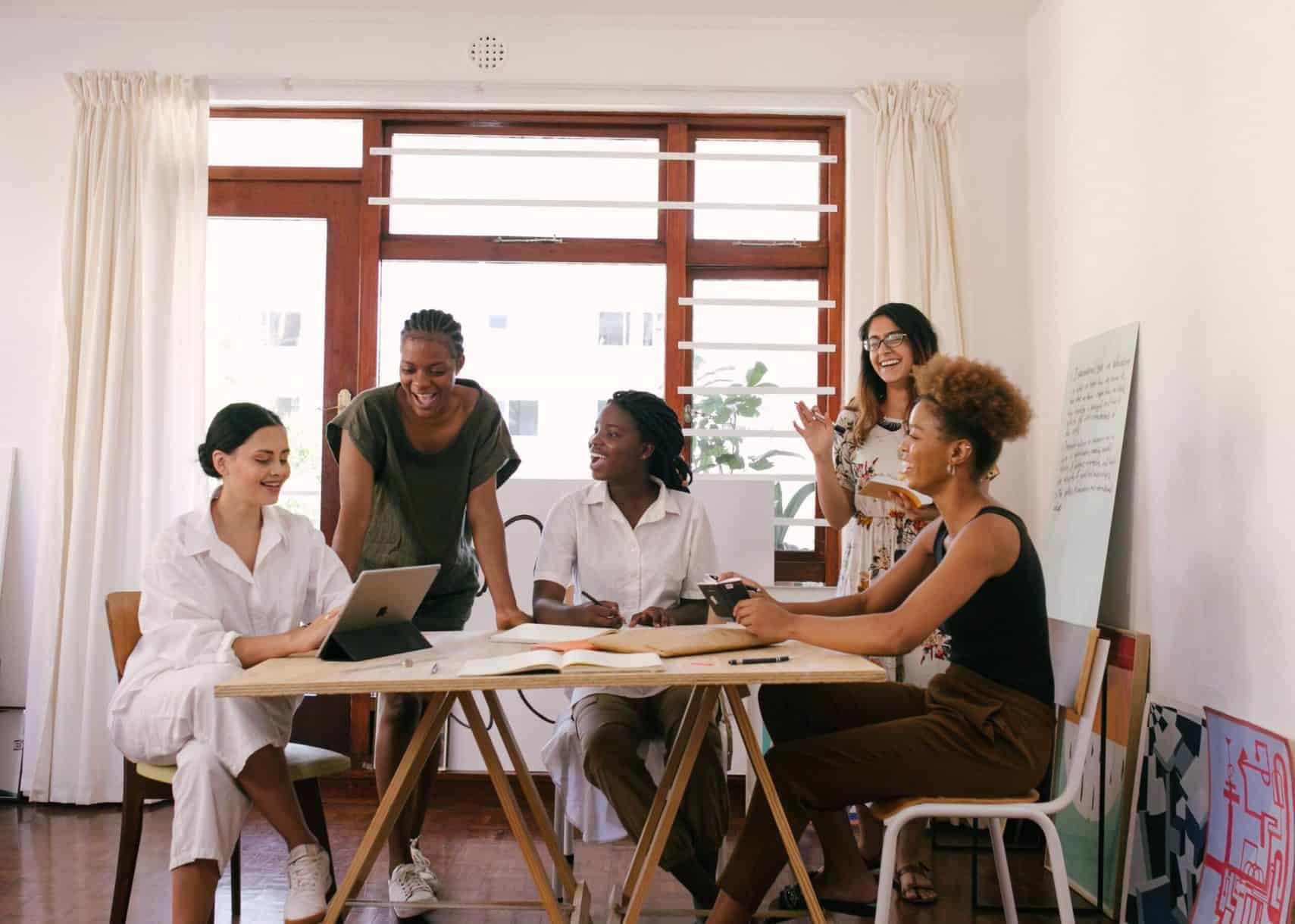 A group of culturally diverse women have a business meeting