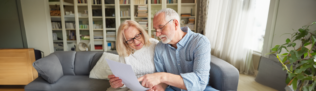 Elderly couple reviewing their Virginia Advance Directive for their medical care