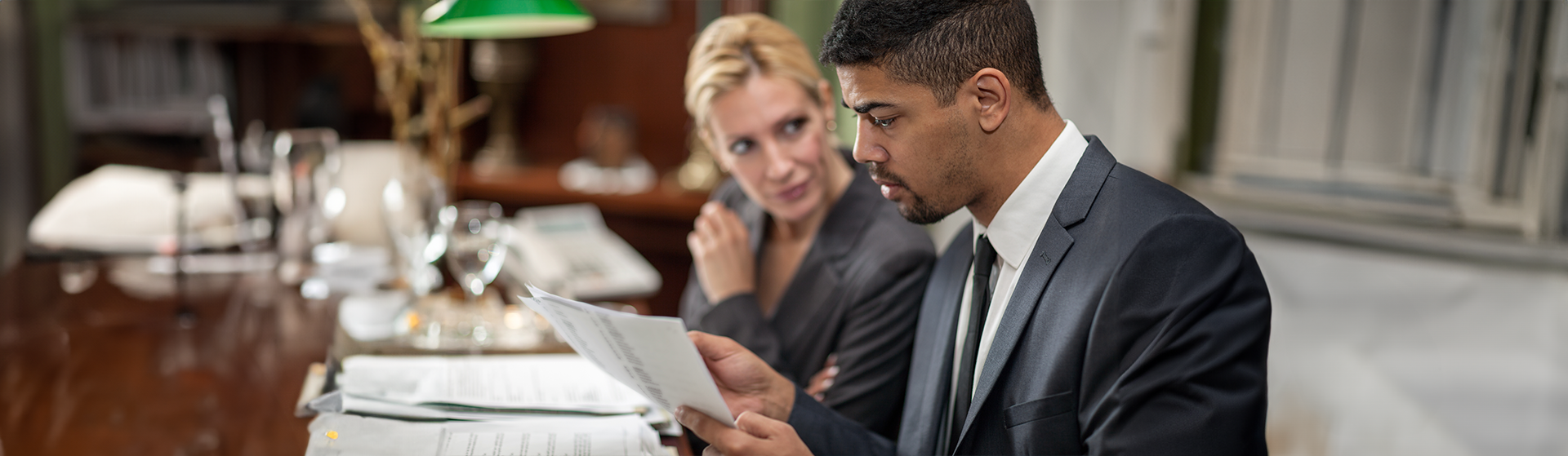 Young business owner consulting with an attorney about his advanced directives for his business operations using a power of attorney